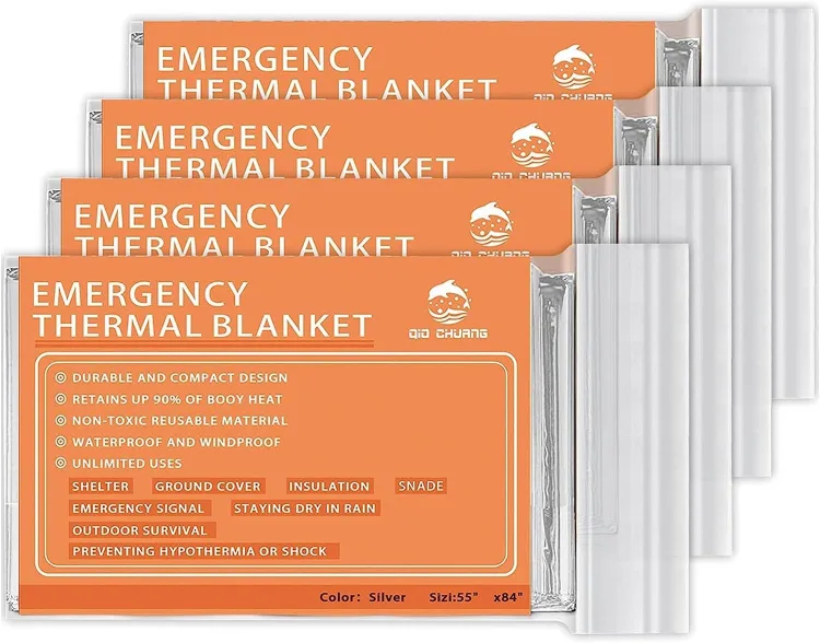 Four sealed QIO CHUANG emergency thermal blanket packets with a silver Mylar edge showing