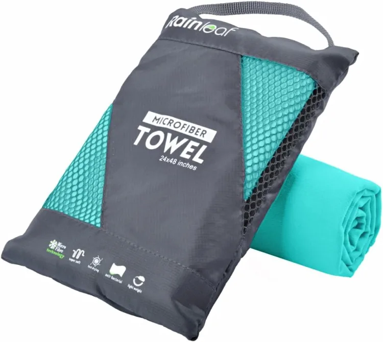 A rolled mint Rainleaf microfiber towel beside its grey mesh carry pouch