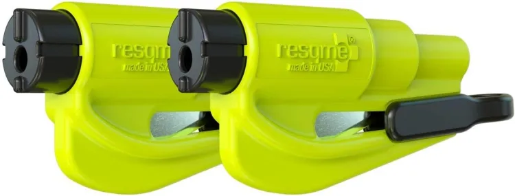 The resqme keychain escape tool with its spring-loaded punch head and belt cutter slot